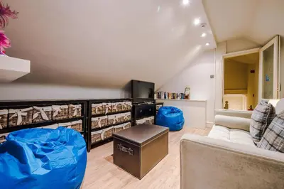 a living room with a couch and a table at Pier View House in Blackpool
