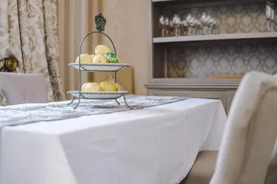 a table with a plate of fruit on top of it at Pier View House in Blackpool
