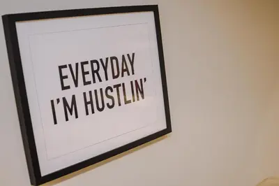 a framed picture with the words everyday im hustlin at Pier View House in Blackpool