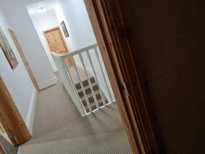 an empty hallway with a stairway leading to a room at Cheerful 4-bedroom holiday home close to the Sea in Blackpool