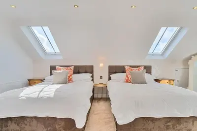 two beds in a room with skylights at Moor End Manor in Poulton le Fylde