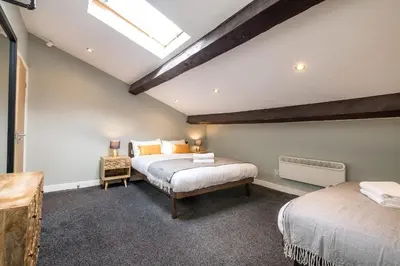 a bedroom with two beds and a skylight at Host & Stay - The Georgian Quarters at Canning in Liverpool