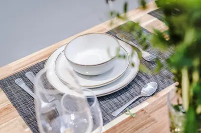 a table with a bowl and plates and a cup at Host & Stay - The Georgian Quarters at Canning in Liverpool