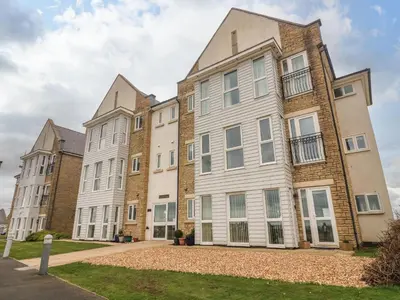 an apartment building with three buildings at Apartment 1 in Morecambe