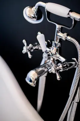 a close up of a chrome bathroom faucet at The Eden Warehouse - Pink Apartment (sleeps 4) in Southport