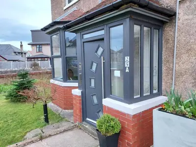 a front door of a house with a blue door at 2 bed apartment 5min from sea in bare Morecombe in Morecambe