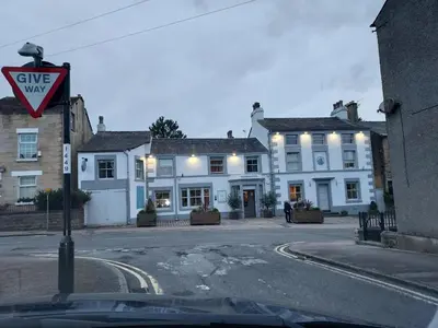 a street with white buildings and a yield sign at 2 bed apartment 5min from sea in bare Morecombe in Morecambe