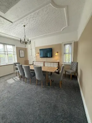 a dining room with a table and chairs at Victorian Villa close to Liverpool City Centre in Liverpool