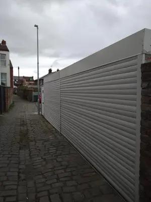 a metal garage door on the side of a building at Marley Mansions Apartment - Egremont Promenade - 42 in Wallasey