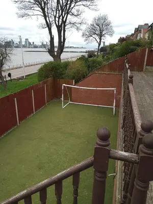 a soccer field with a goal on the grass at Marley Mansions Apartment - Egremont Promenade - 42 in Wallasey
