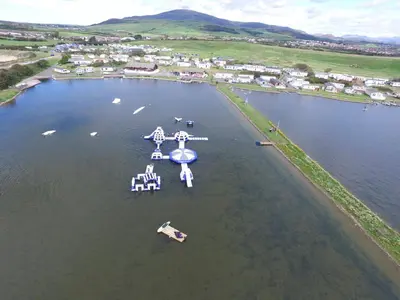 an aerial view of a lake with boats in the water at Driftwood Cottage Port Haverigg Marina Village in Millom