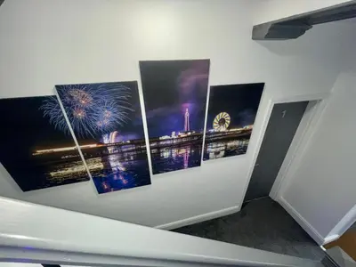 a wall with four pictures of fireworks on it at Osborne hot tub and jacuzzi suites in Blackpool