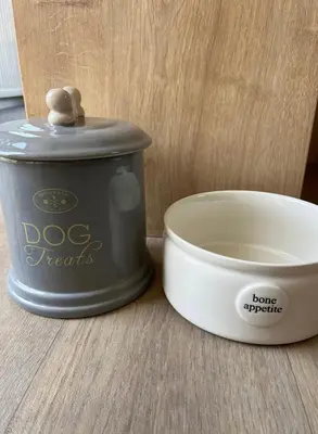 a dog treats container next to a bowl of food at 2 Bed - Sleeps 6 - 15min Walk to Beach in Morecambe
