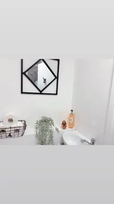 a bathroom with a sink and a mirror on the wall at Ivy Chic Apartments by CityNest in Blackpool