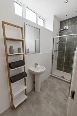 a bathroom with a sink and a shower at Mode Apartments Winter Gardens Blackpool in Blackpool