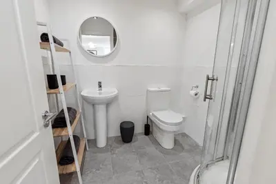 a small bathroom with a toilet and a mirror at Mode Apartments Winter Gardens Blackpool in Blackpool