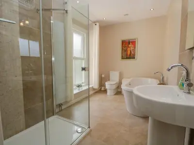 a bathroom with a shower and a sink and a toilet at Crow's Nest in Carnforth