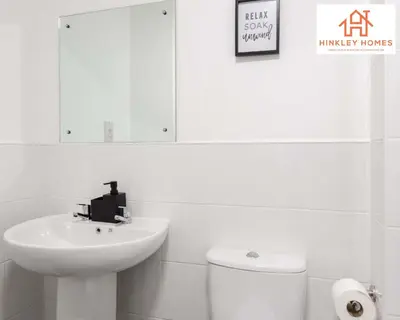 a white bathroom with a sink and a toilet at Modern Townhouse - Free Gated Parking - City Centre - 5 ! By Hinkley Homes Short Lets & Serviced Accommodation in Liverpool