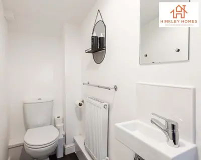 a white bathroom with a toilet and a sink at Modern Townhouse - Free Gated Parking - City Centre - 5 ! By Hinkley Homes Short Lets & Serviced Accommodation in Liverpool