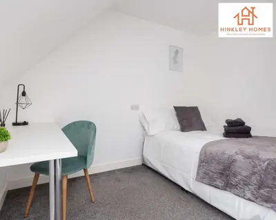 a bedroom with a bed and a desk and a table at Modern Townhouse - Free Gated Parking - City Centre - 5 ! By Hinkley Homes Short Lets & Serviced Accommodation in Liverpool