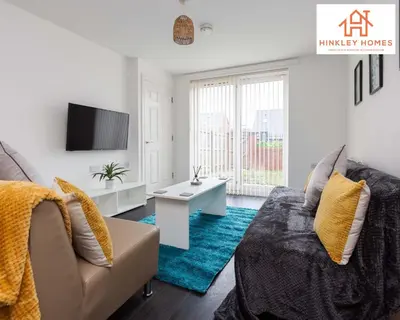 a living room with a couch and a tv at Modern Townhouse - Free Gated Parking - City Centre - 5 ! By Hinkley Homes Short Lets & Serviced Accommodation in Liverpool