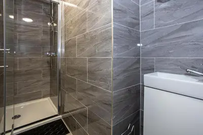 a bathroom with a shower and a sink and a toilet at TCO Luxury House in Liverpool