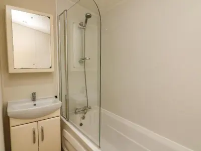 a bathroom with a shower and a sink at The Bobbin, Number 11 in Carnforth