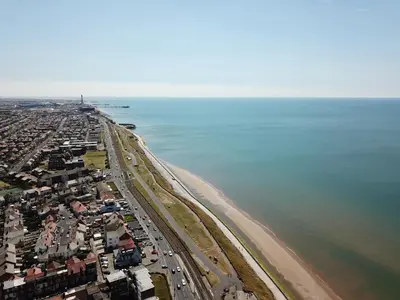 an aerial view of a beach and the ocean at Granada Apartments Derby Road in Blackpool