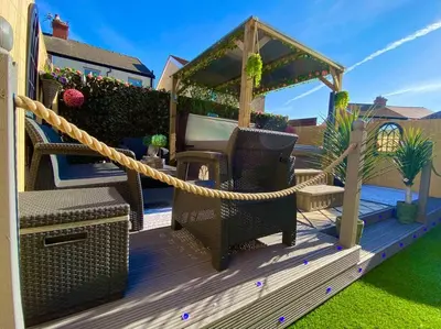 a deck with a net and a gazebo at NEW…THE HOTTUB HOUSE BLACKPOOL PLEASURE BEACH in Blackpool