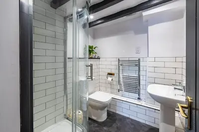 a bathroom with a toilet and a sink at Royal Oak Pub in Cartmel