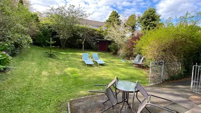a yard with chairs and a table and chairs at SANDYVIEWS in Grange Over Sands