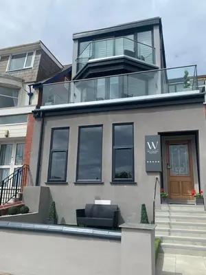 a large house with a balcony on top of it at Willshaw Suites for families over 25 only in Blackpool