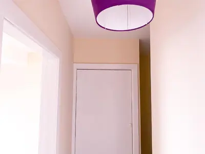 a room with a white cabinet and a purple ceiling at Anfield Apartment in Liverpool