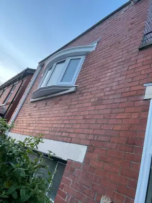 a window on the side of a brick building at Avondale, Lytham - Unique and luxury apartment in the heart of Lytham in Lytham St Annes