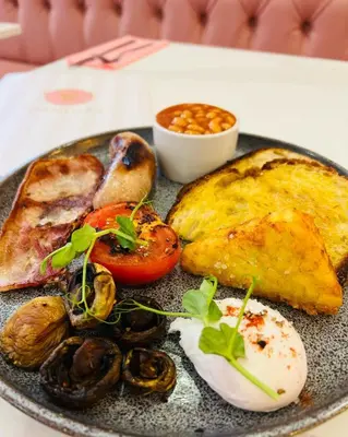 a plate of food with oysters and meat on a table at Cube Apartments in Lytham St Annes