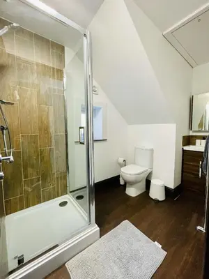 a bathroom with a shower and a toilet at Cube Apartments in Lytham St Annes