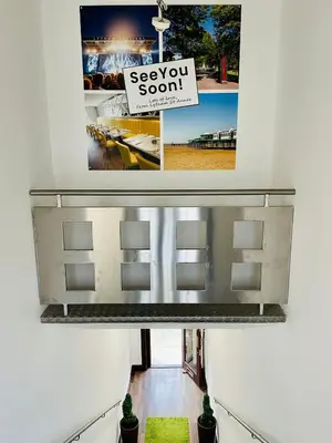 a view of a hallway with a sign on a wall at Cube Apartments in Lytham St Annes