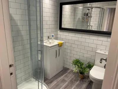 a bathroom with a shower and a sink and a toilet at Tranquil 3 bedroom town house with Sky Glass in Thornton