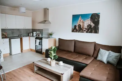 a living room with a couch and a table at Flat 5 Lovely 1-bedroom flat in Liverpool in Liverpool