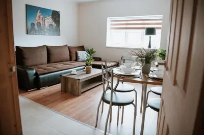 a living room with a table and a couch at Flat 5 Lovely 1-bedroom flat in Liverpool in Liverpool