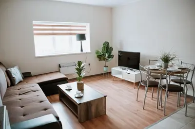 a living room with a couch and a table at Flat 5 Lovely 1-bedroom flat in Liverpool in Liverpool