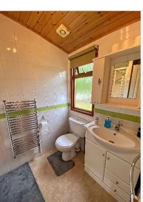 a bathroom with a toilet and a sink at Dot's Place 1 in Carnforth