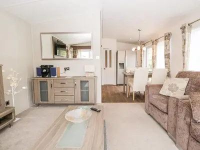 a living room with a couch and a table at Number 10 in Carnforth