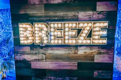 a sign that says on a wall with lights at BREEZE BLACKPOOL LUXURY SUITES in Blackpool