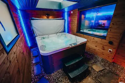 a bathroom with a bath tub in a house at BREEZE BLACKPOOL LUXURY SUITES in Blackpool