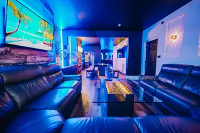 a living room with a couch and a table at BREEZE BLACKPOOL LUXURY SUITES in Blackpool