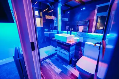 a bathroom with a sink and a toilet at BREEZE BLACKPOOL LUXURY SUITES in Blackpool
