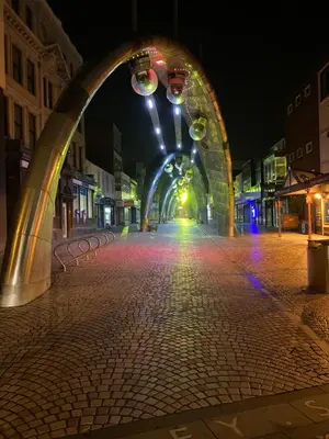 an archway on a city street at night at Winter Gardens North Pier 2 Bed in Blackpool