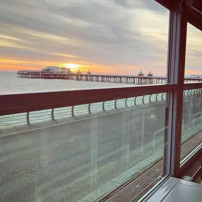 a view of a pier from a window at Winter Gardens North Pier 2 Bed in Blackpool