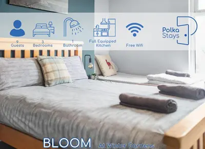 a bedroom with a bed with two pillows on it at PolkaDot Winter Gardens - Large Modern Apartments in Blackpool by PolkaStays in Blackpool